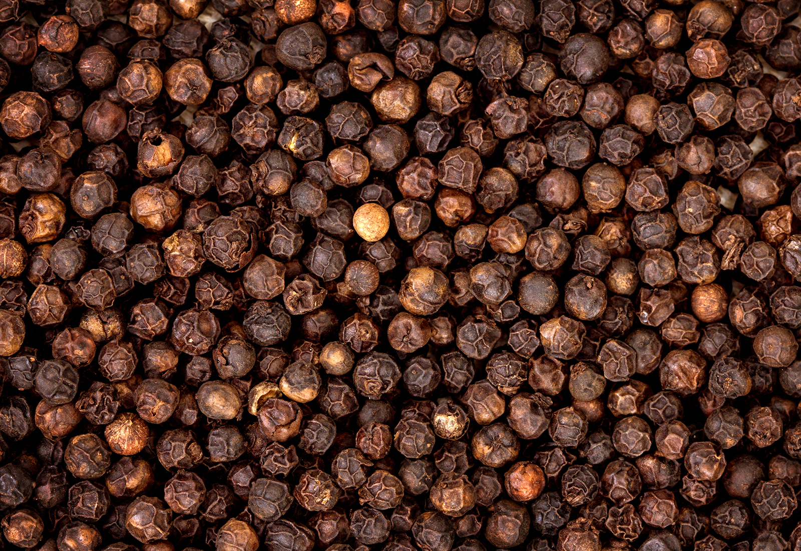closeup the dried black pepper as background