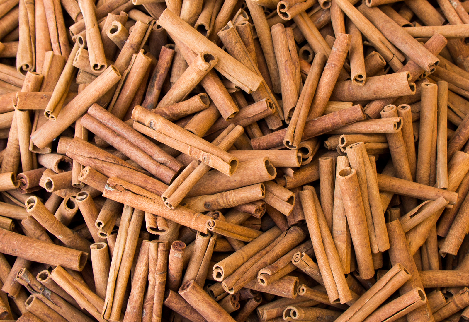 Stack of  of Cinnamon sticks in view as  background